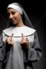 istockphoto_788701-woman-dressed-as-nun-giving-middle-finger-gesture.jpg