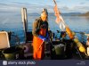 fisherman-laying-out-longline-for-black-cod-commercial-fishing-chatham-DRN54Y.jpg