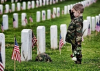 Boy saluting at Arlington.png