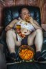 photo-fat-couch-potato-eating-huge-hamburger-watching-television-harsh-lighting-television-ill...jpg
