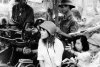 Jane-Fonda-in-North-Vietnam-with-helmet-at-AA-Gun.jpg