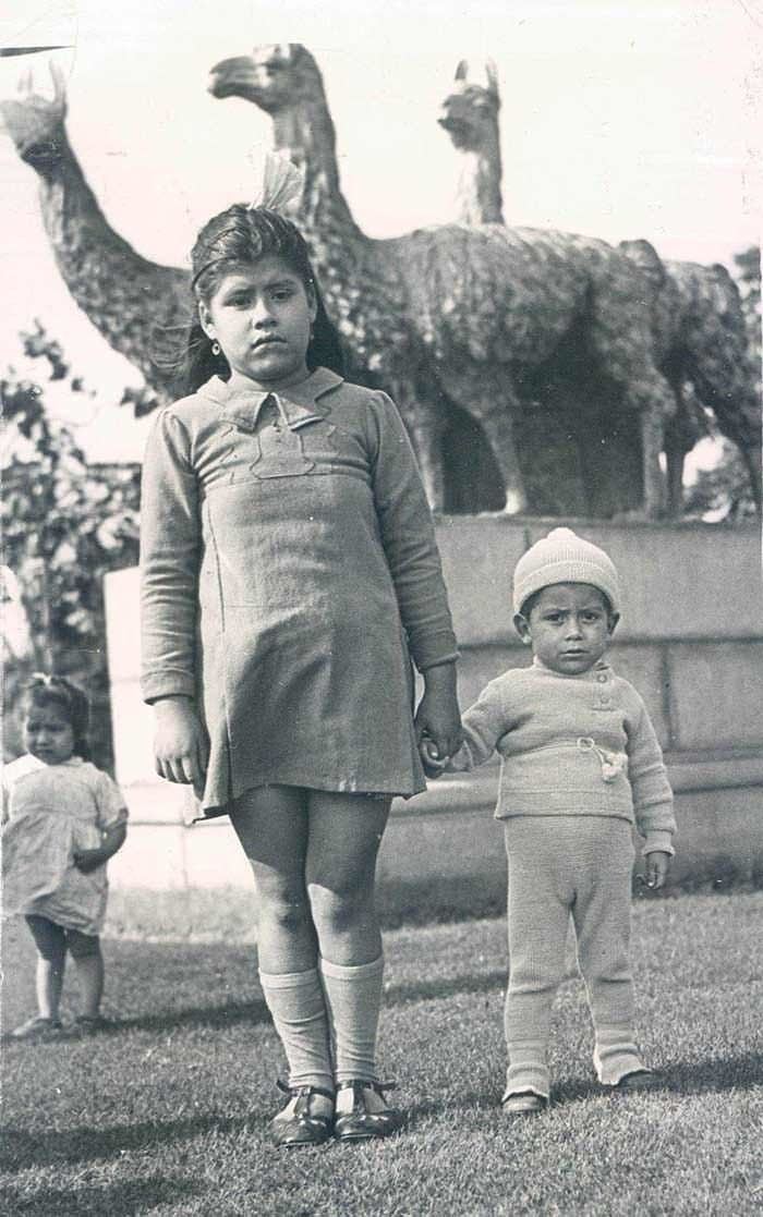 Lina Medina holding her son