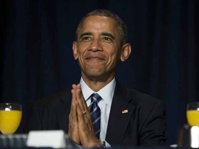 obama-praying-smile-AP-640x480.jpg