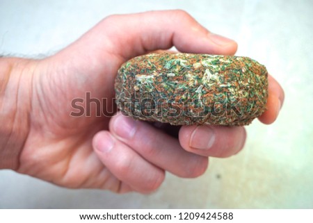 compressed-brick-weed-has-shape-450w-1209424588.jpg