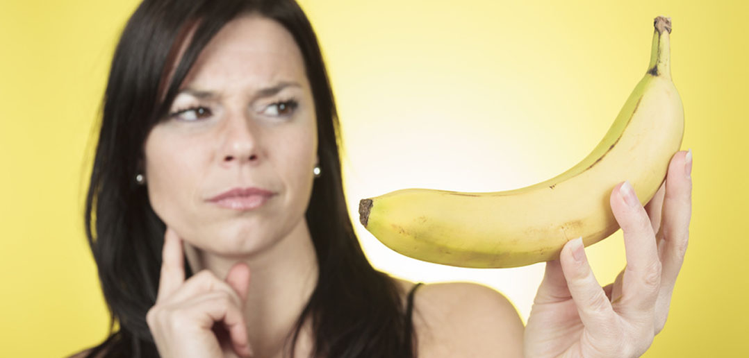 Woman-looking-at-a-banana-by-pololia.jpg