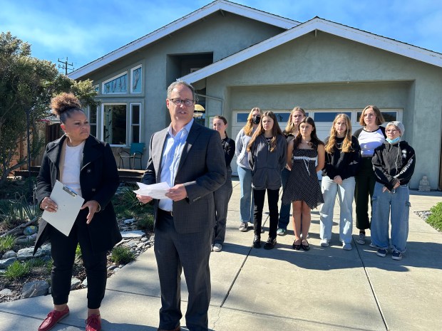 Santa Cruz Mayor Sonja Brunner, at left, and Santa Cruz County Supervisor Ryan Coonerty, are backed by a group of Pacific Collegiate School students Thursday during a press conference addressing the forced removal of two Santa Cruz children during a parental custody dispute. (Jessica A. York -- Santa Cruz Sentinel)